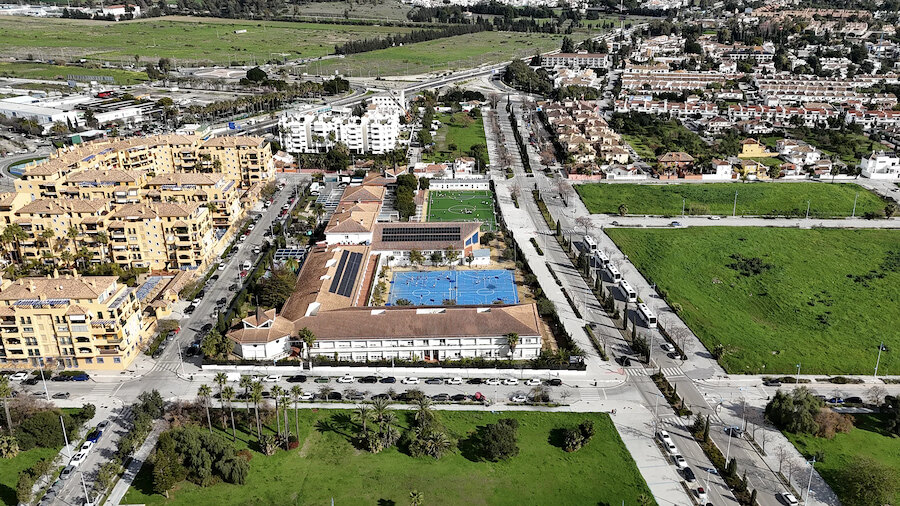 Aerial view of one of the International Schools in Marbella, with sports courts and surrounding residential areas