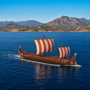 Illustration of an ancient sailing ship off Marbella’s mountainous coast, evoking the region’s ancient history.