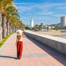 Palm-lined seaside promenade in Málaga, a perfect example of how walkable cities connect beaches, landmarks and daily life.