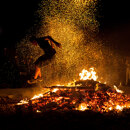 San Juan night in Marbella: Traditional fire-jumping scene.