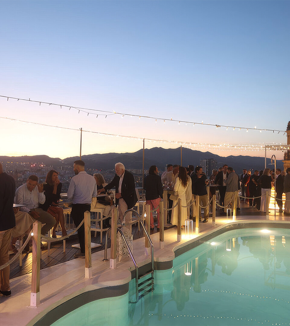 Rooftop terrace with pool and sunset views during the General Meeting GIPE reception in Málaga.