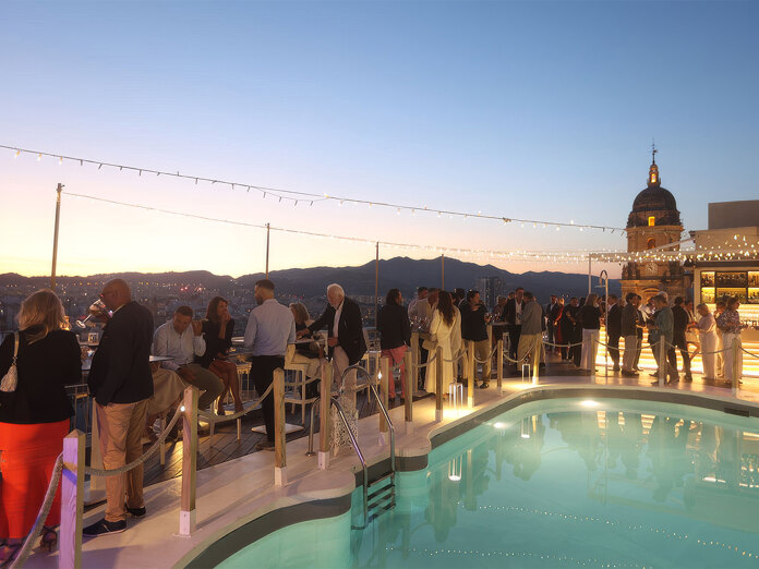Rooftop terrace with pool and sunset views during the General Meeting GIPE reception in Málaga.