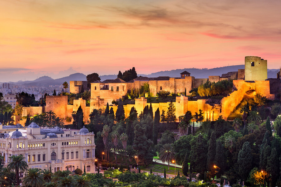 View of the Alcazaba of Málaga illuminated at sunset.