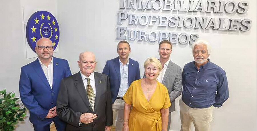 Group of attendees posing at the headquarters of European real estate professionals.