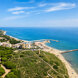Aerial view of Cabopino beach, marina and protected dunes along the Marbella East coast