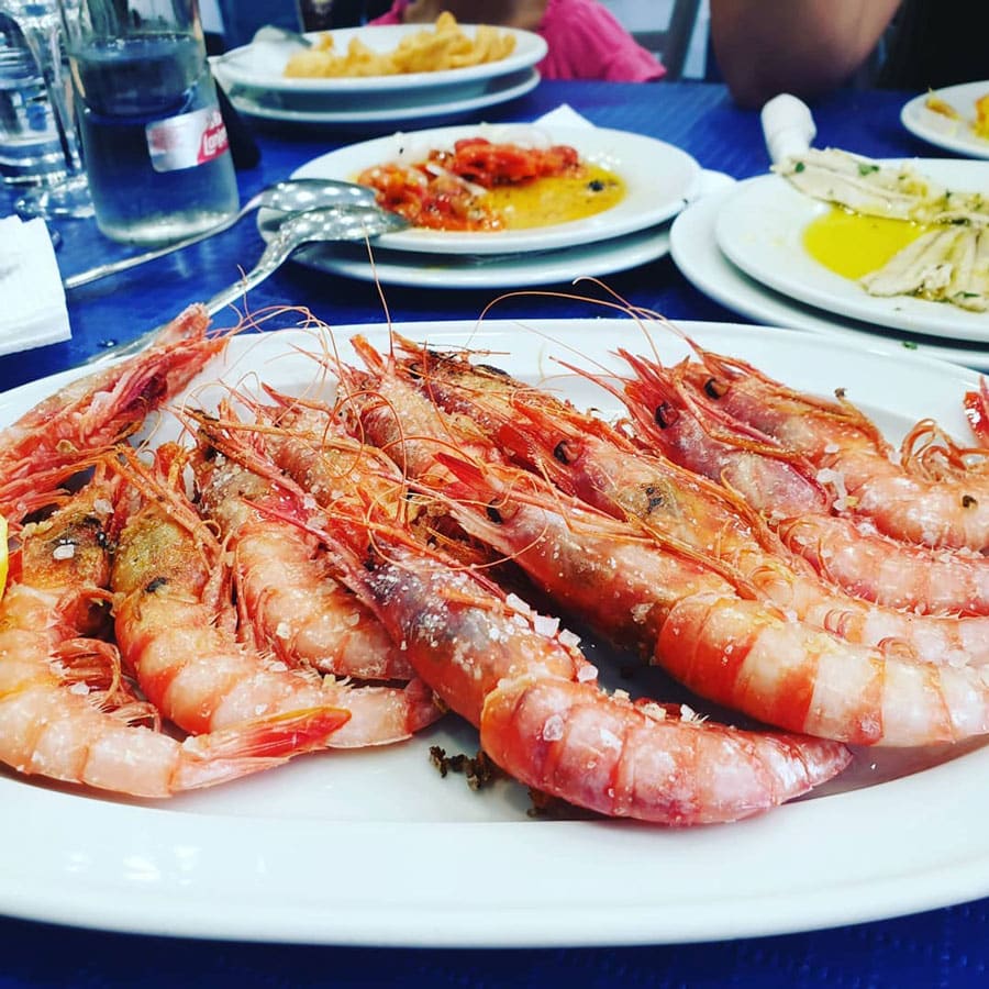 Grilled prawns with sea salt served at a restaurant known for some of the best seafood in Marbella