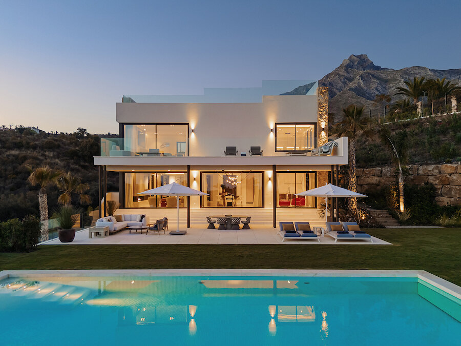Contemporary luxury home at sunset with pool, featured among the best villas in Marbella with spa