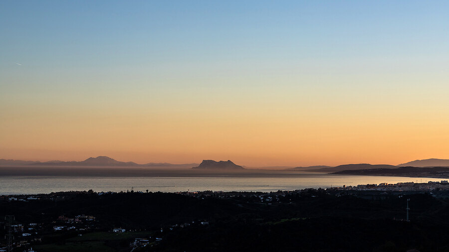 Serene sunset over distant mountains