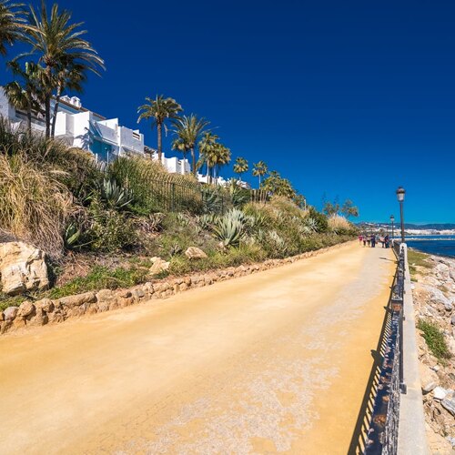 Beachside promenade accessible from Marina Puente Romano