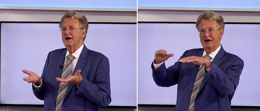 Christopher Clover speaking during an RTV Marbella interview, shown in two side-by-side frames while gesturing as he explains a point.