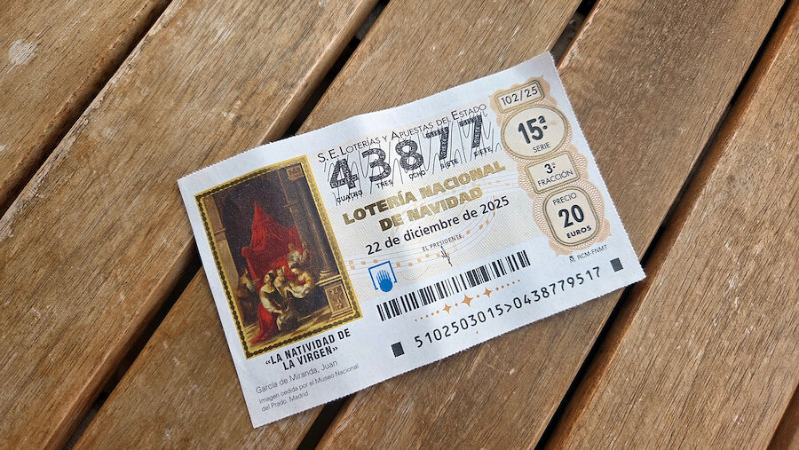 Spanish Christmas lottery ticket (“Lotería de Navidad”) lying on a wooden table.