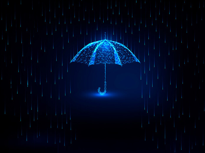 Home insurance. Rain falling and umbrella covering from the rain