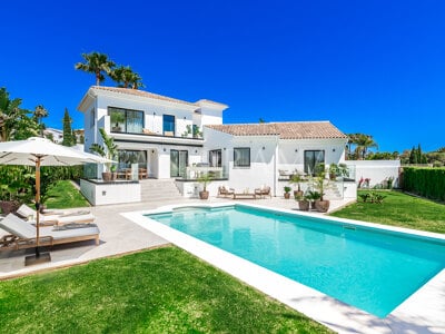 Beautiful villa with stunning views of mountains, the golf course, and the sea