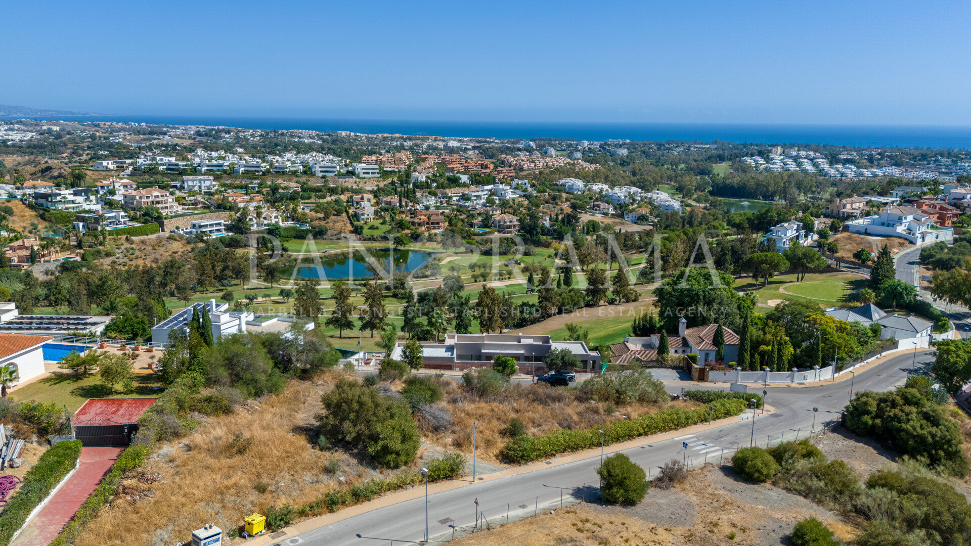 Exceptional plot in La Alquería with panoramic sea, lake and golf views – among the very last available