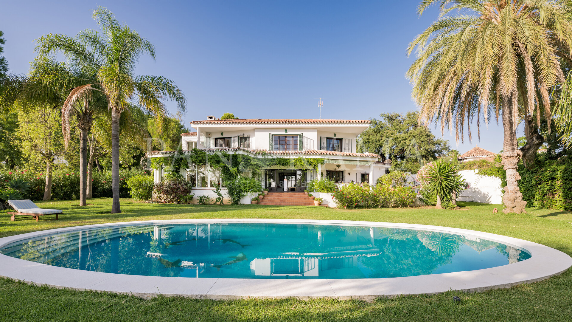 Charming family villa with sea and mountain views, lush garden and serene poolside next to Marbella Town