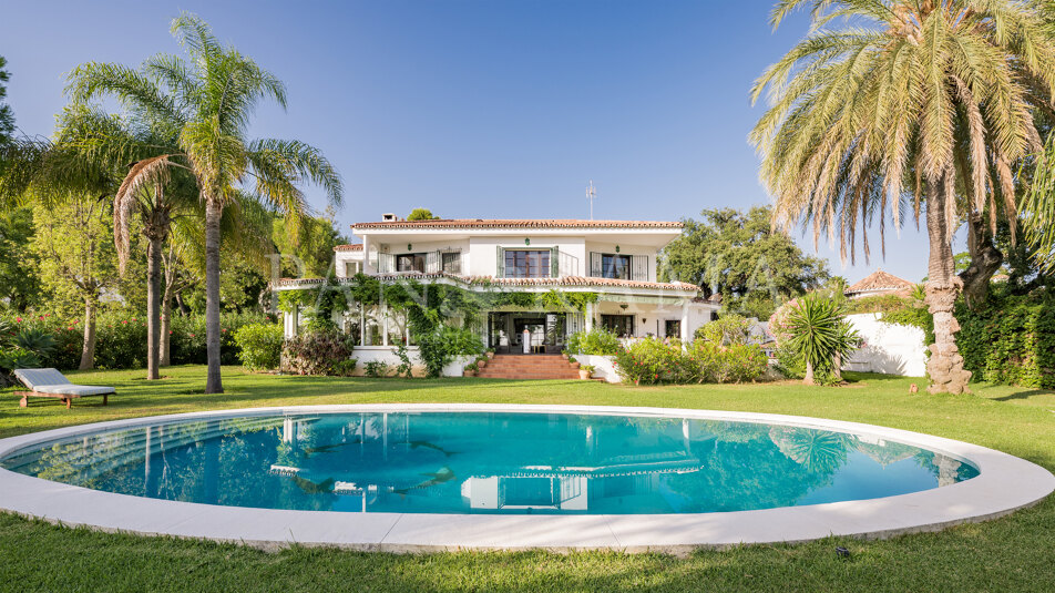Charming family villa with sea and mountain views, lush garden and serene poolside next to Marbella town