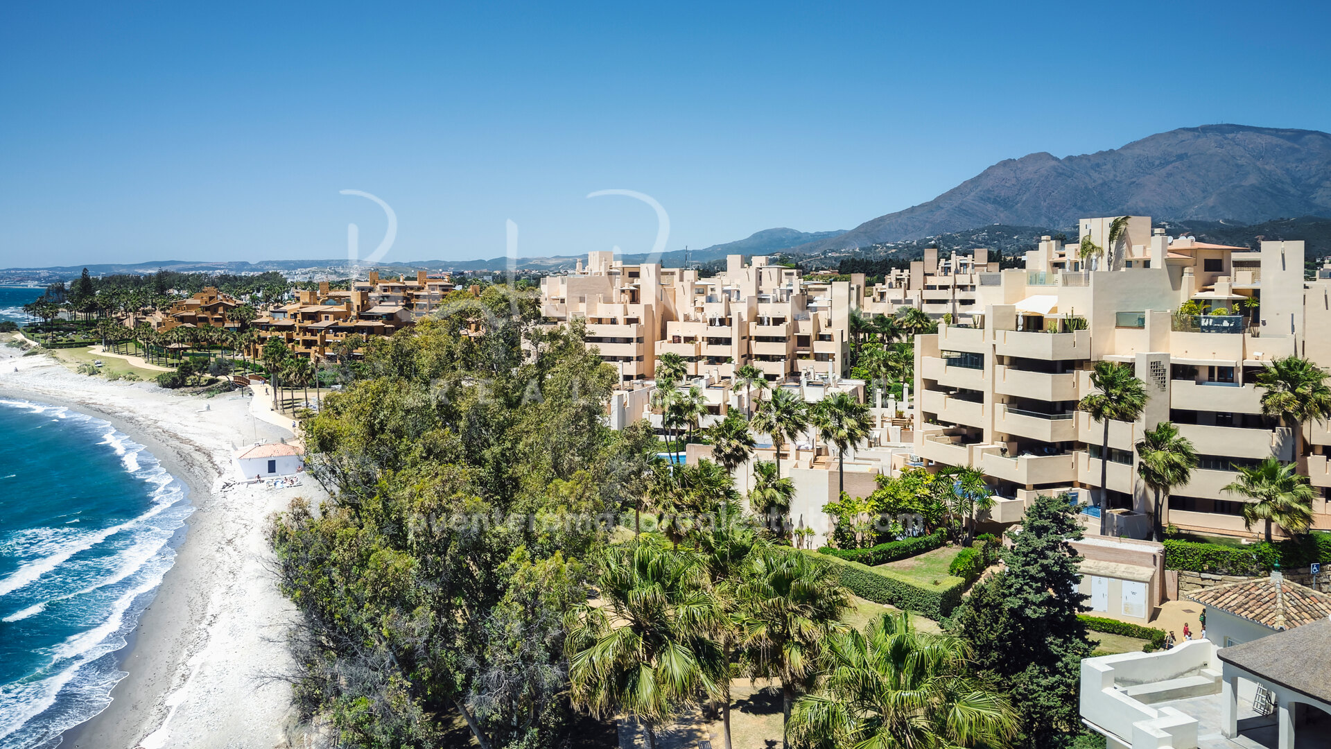 Beachside duplex penthouse within a gated community in Estepona