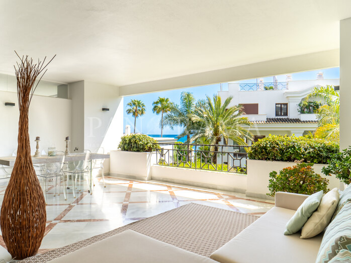 Elegant two-bedroom beachside apartment with partial sea views in Doncella Beach